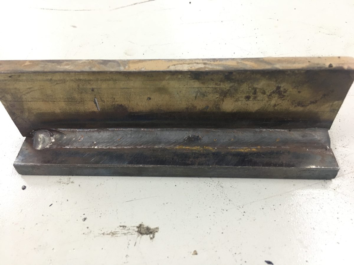 This weld was made on 1/4″ A36 steel with 0.035″ ER70S-6 and 98%Ar/2%CO2 shielding gas in spray transfer. This shielding gas mixture is for GMAW of stainless steels.